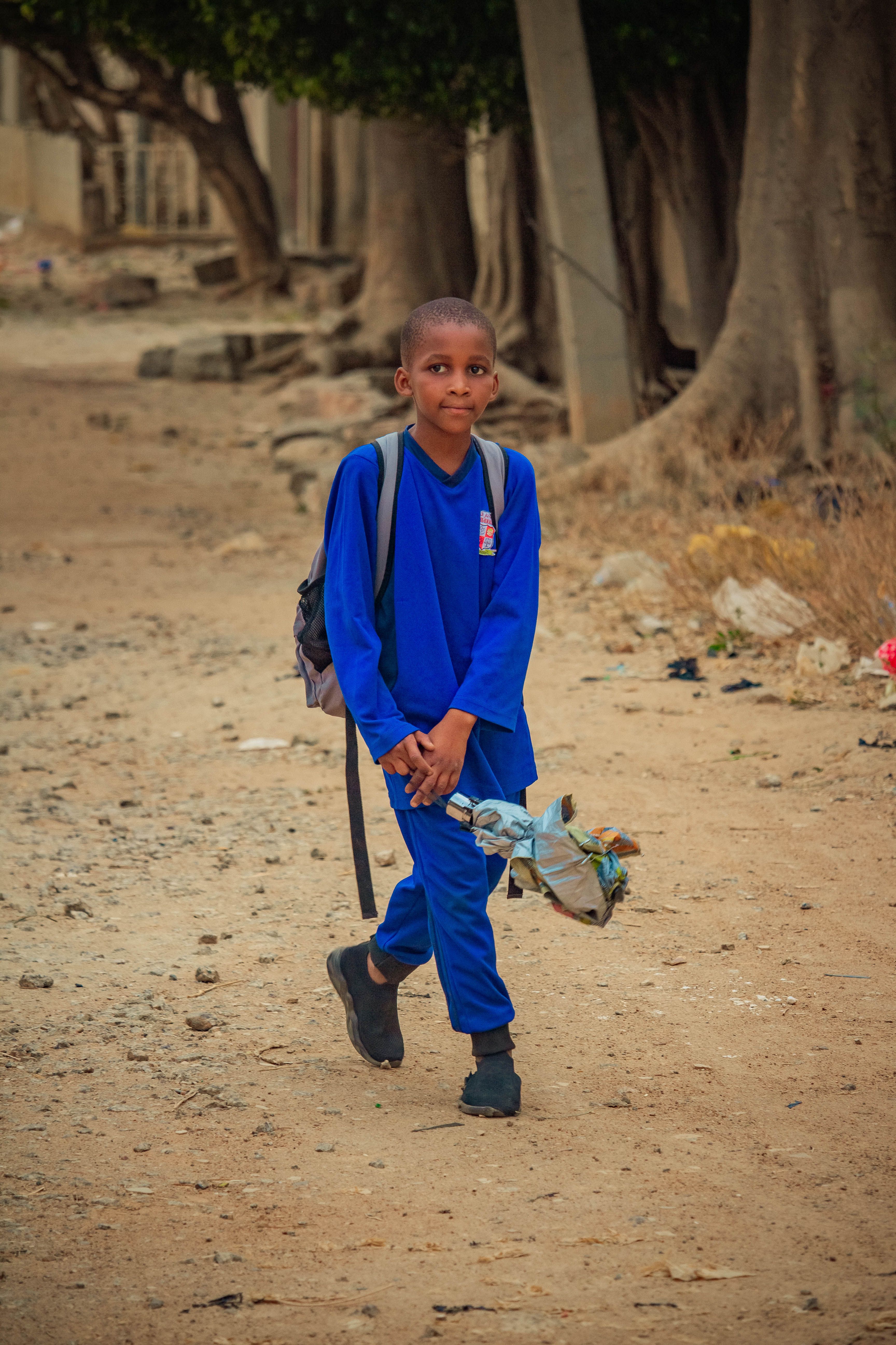 A child walking to school with a backpack